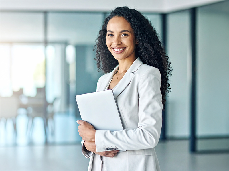 Firefly_A confident business professional standing in a modern office, holding a white clipbo 384894-800-600